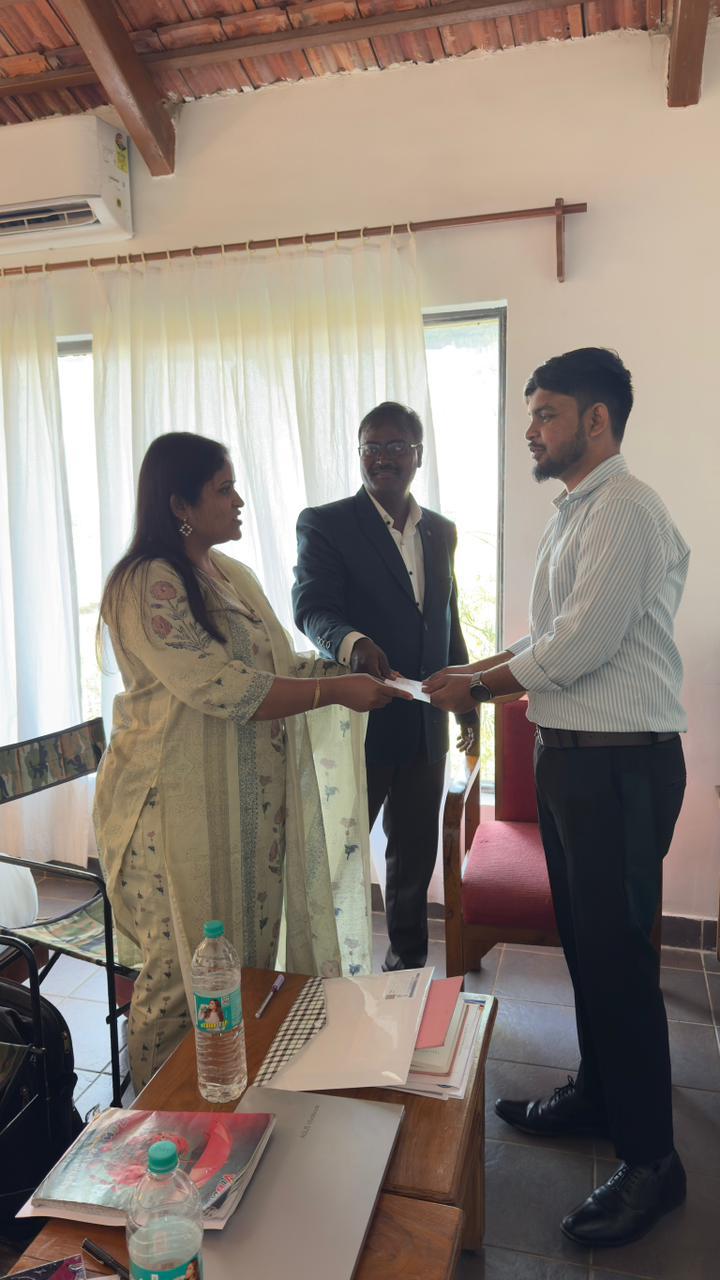 Universe Formulations founder with team members at a company meeting