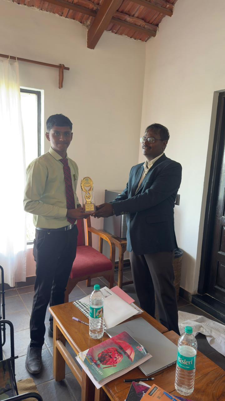 Universe Formulations team members with a recognition trophy
