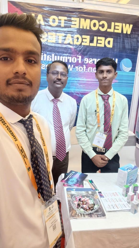 Universe Formulations team member at the conference stand