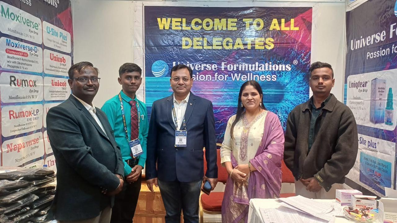 Universe Formulations team members with delegates at a conference stand